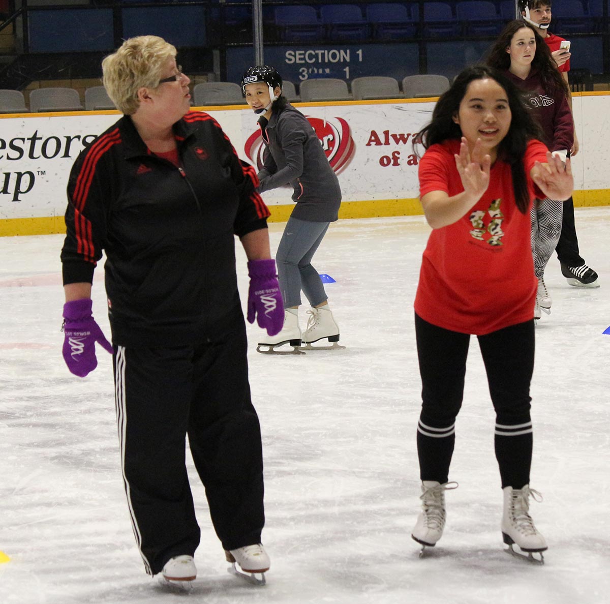 Canadore College student learns to skate. 